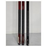 Three billard sticks