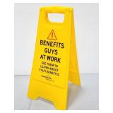 Benefits Guys at work yellow floor sign