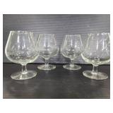 Set of four etched brandy glasses