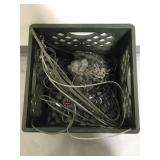 Crate of metal wire rope and chains