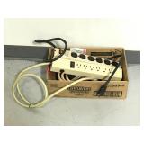 Box of 2 power strips and 3 extension cords