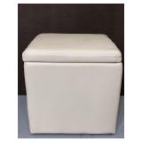 Cream colored vinyl storage footstool ottoman