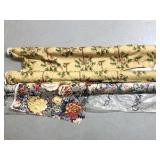 Three rolls of fabric- 2 monkey and 1 floral