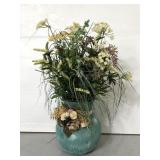 Faux flower arrangement in blue painted vase