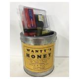 Can of assorted household supplies