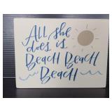 All she does is beach beach beach sign
