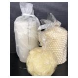 Three unopened fancy decorative candles