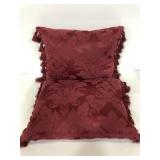 Pair of matching red feather down throw pillows