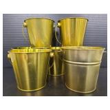 Seven small metal pails