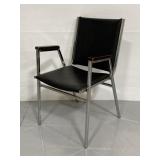 Vintage upholstered chrome & wood arm chair
