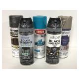 Five cans of assorted spray paint