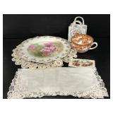 Assortment of floral China and doilies
