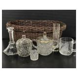 Wicker basket of assorted etched and cut glass