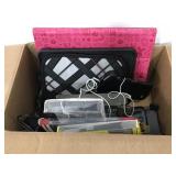 Box of phone accessories and other electronics