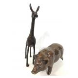 Brass giraffe and clay pig figures