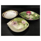Three floral ceramic celery dishes