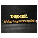 Two yellow, orange and other artsy bracelets