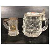 Two miniature glass steins