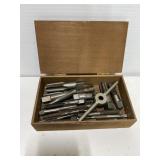 Assorted thread taps in old wooden box