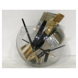 Clear glass vase w/ assorted paint brushes