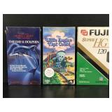 Three sealed assorted VHS tapes