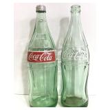 Two vintage glass Coca-Cola bottles