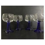 Set of four small glass blu stem goblets