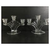 Two glass triple candlestick holders