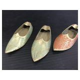 Three brass etched tiny shoe ashtrays