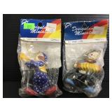 Two unopened Designland clown ornaments