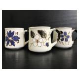 Three stoneware floral mugs