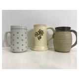 Three large ceramic mugs