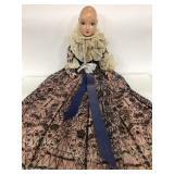 Vintage soft bodied doll with antique style dress