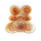 Eight vintage carnival glass saucer plates