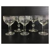 Five small stemmed glasses