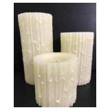Three textured flameless candles