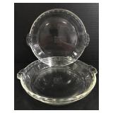 Two glass Pyrex pie dishes