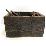 Small wood crate of vintage hardware