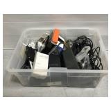 Tote of assorted electronic cords, remotes, etc.