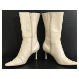 Pair of tan leather Moda zip up heel boots