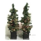 Pair of lighted Christmas tree planters