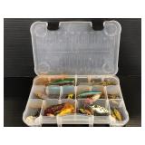 Clear container of assorted fishing lures