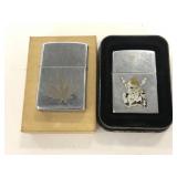 Two Zippo decorated lighters with cases