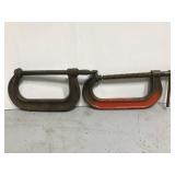 Two metal work table clamps