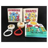 Vintage character baby books and rattles