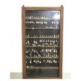 Large spoon collection in vintage wood display