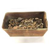 Metal box of assorted rocks and seashells