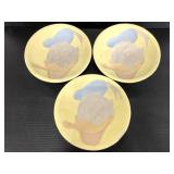 Three Donald Duck painted pottery made bowls
