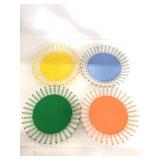 Four woven colorful paper plate holders