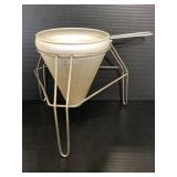 Vintage tin cone shaped strainer with stand